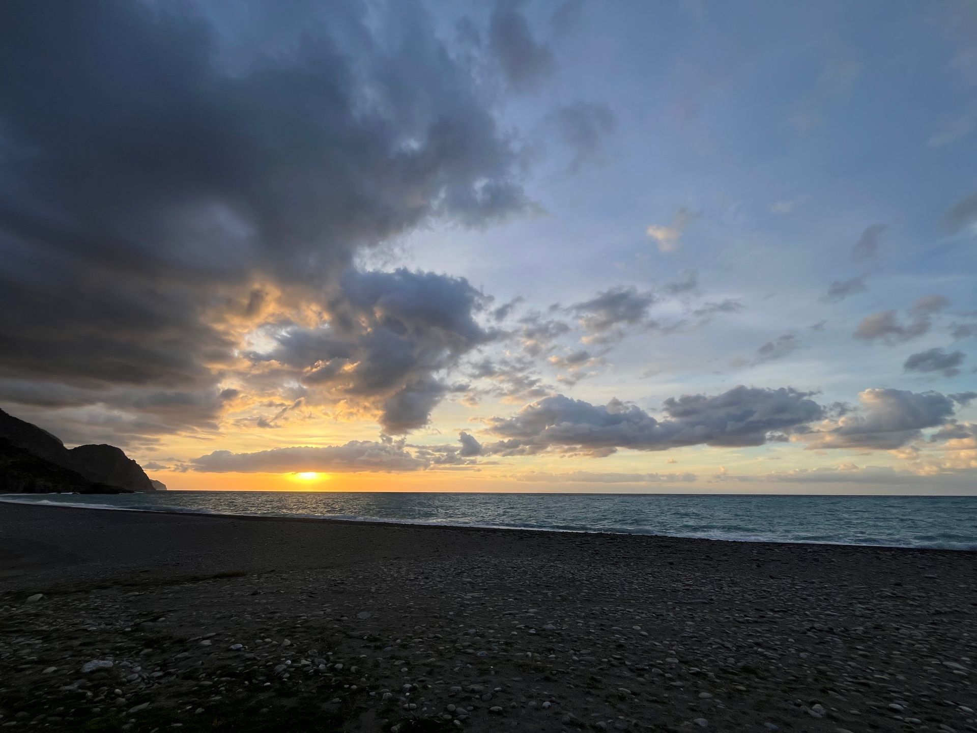 Sunset under heavy clouds