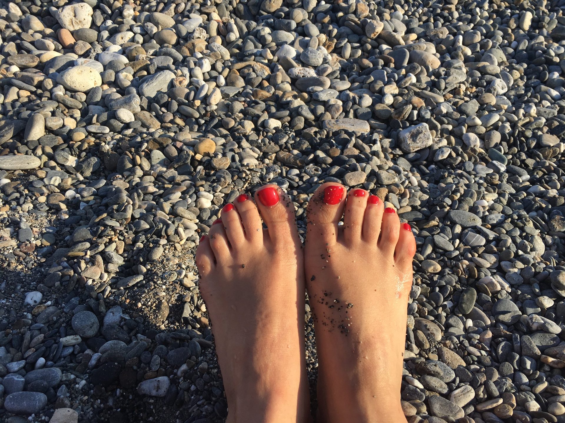 Bare feet on the pebbles of Sougia beach