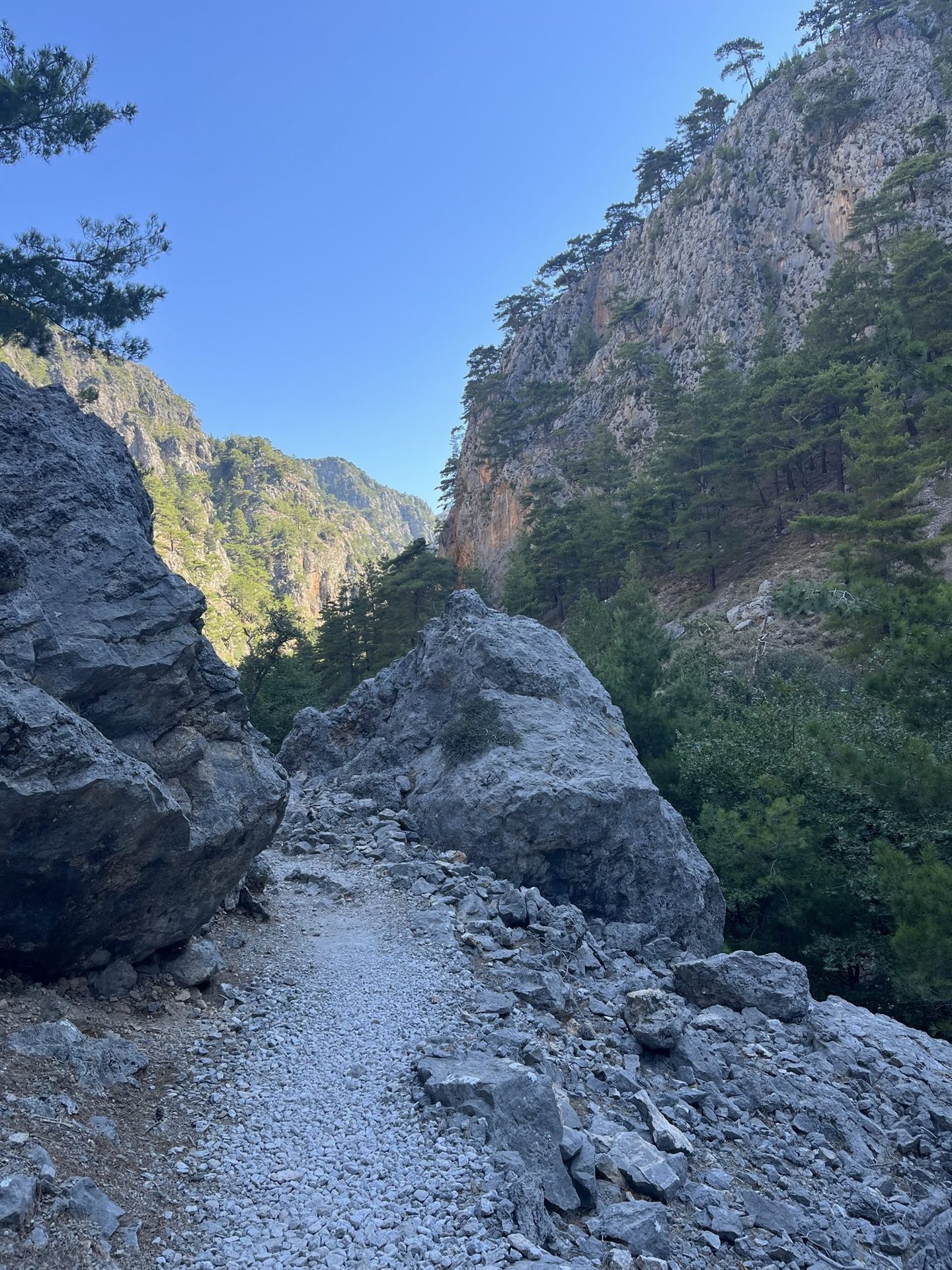 The path between two boulders under the walls of the Agia Irini gorge