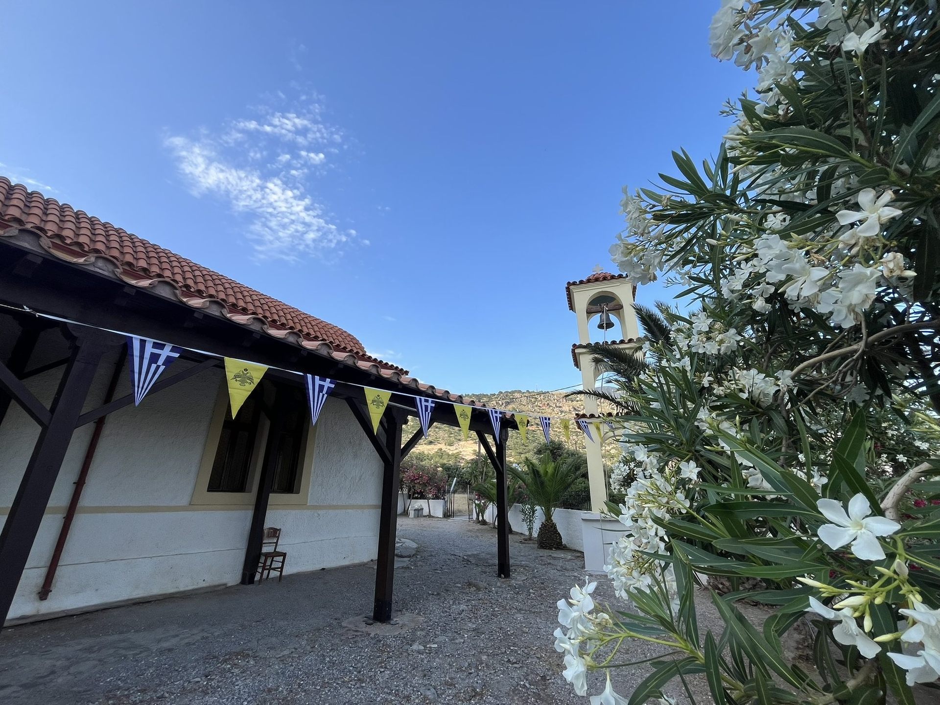 The church of Saint Panteleimon in Sougia, with its bell tower and white oleander