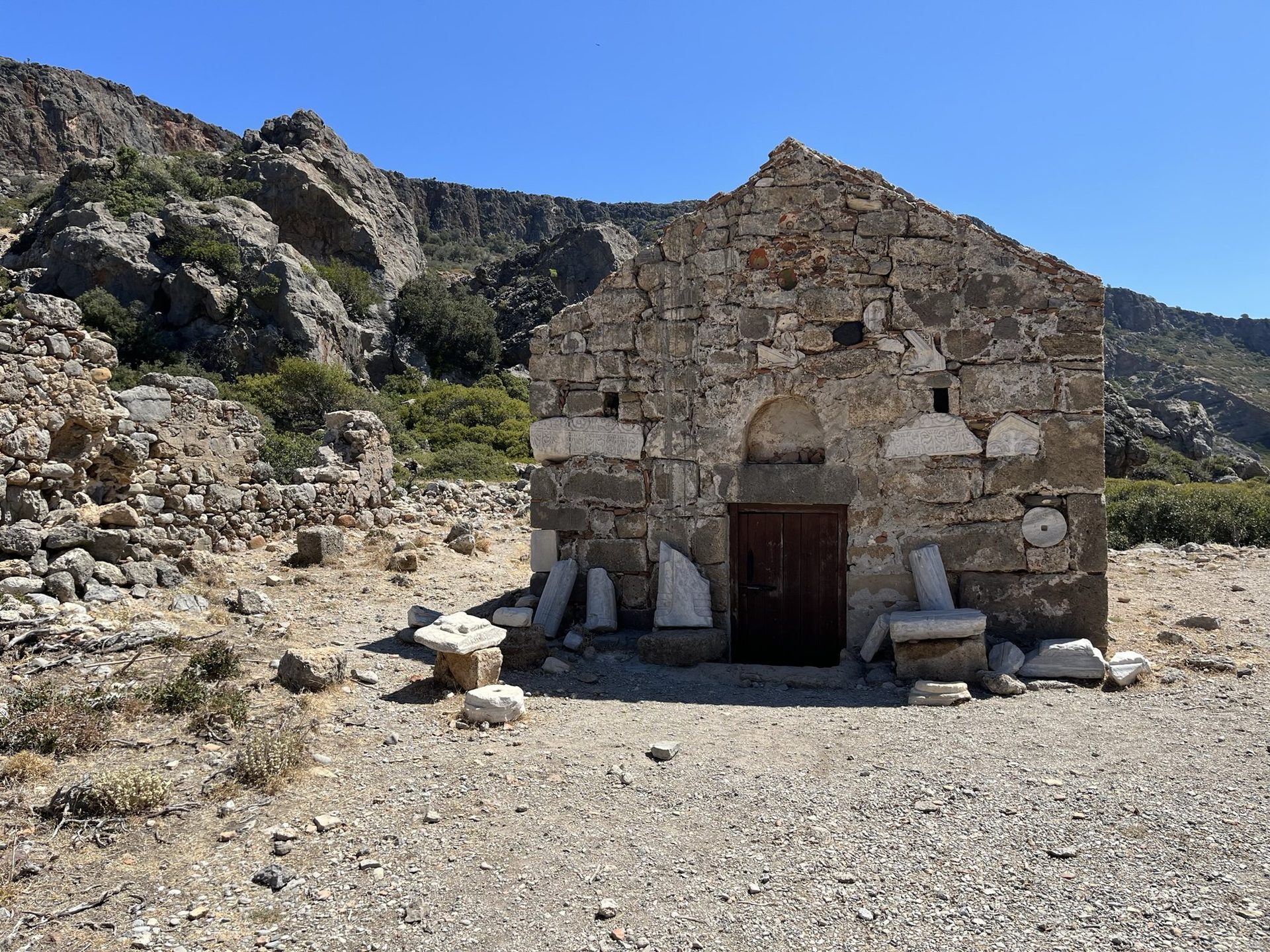 A small stone chapel at Lissos with pieces of ancient marble in its walls