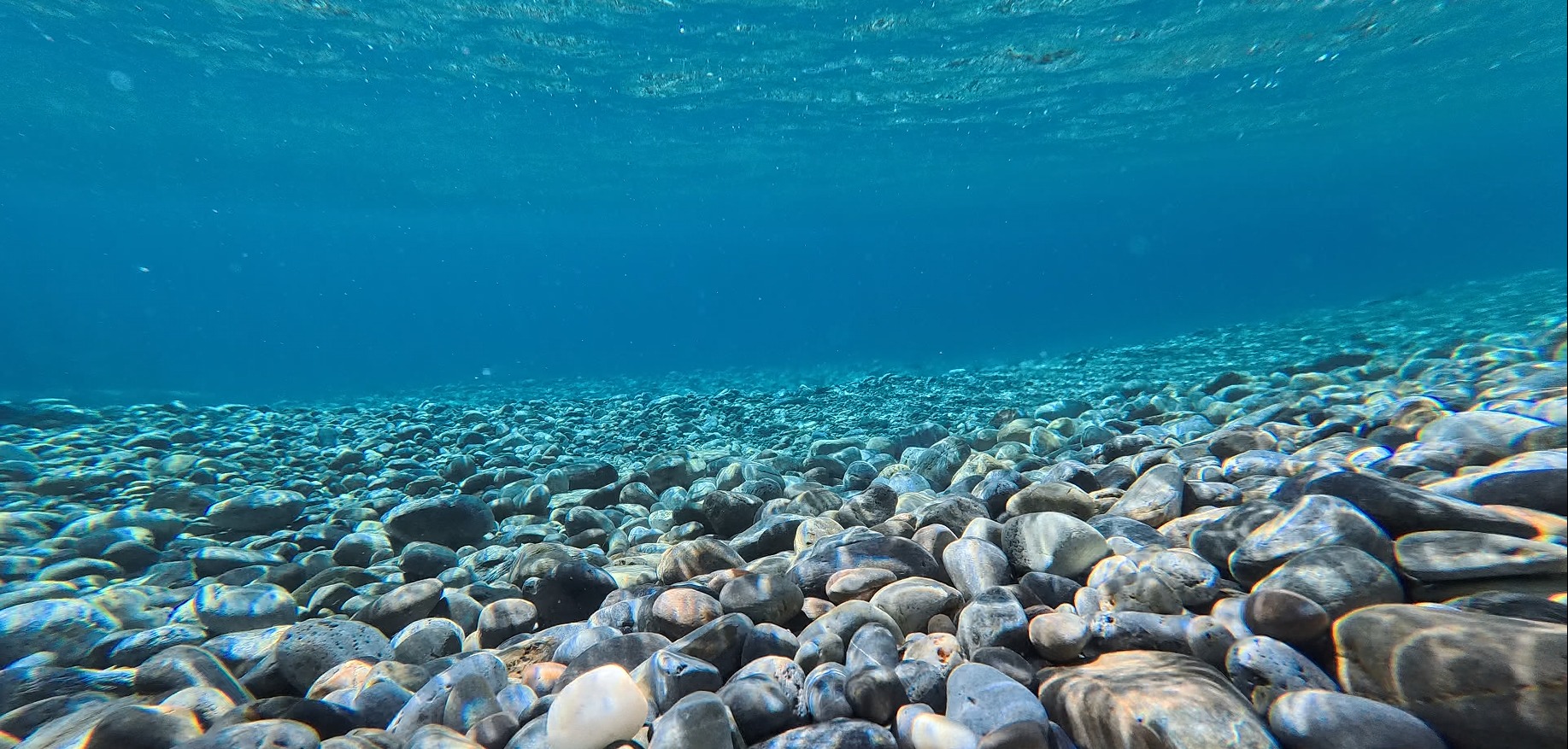 Beneath the surface over the pebbles of Sougia