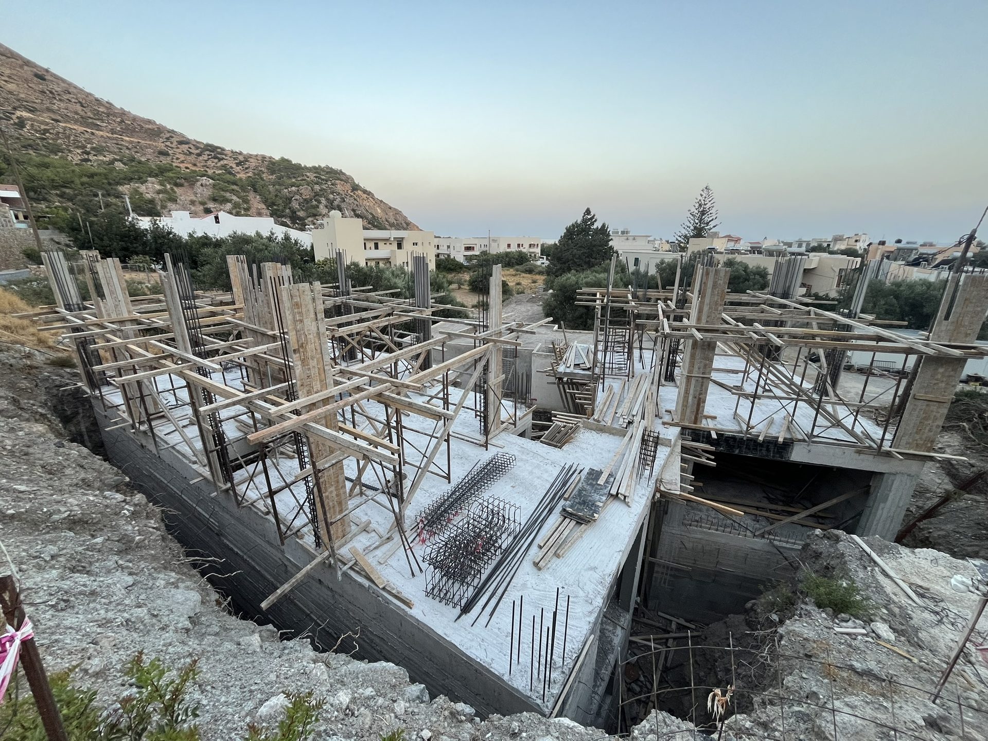 The concrete frame with formwork and steel, August 2026