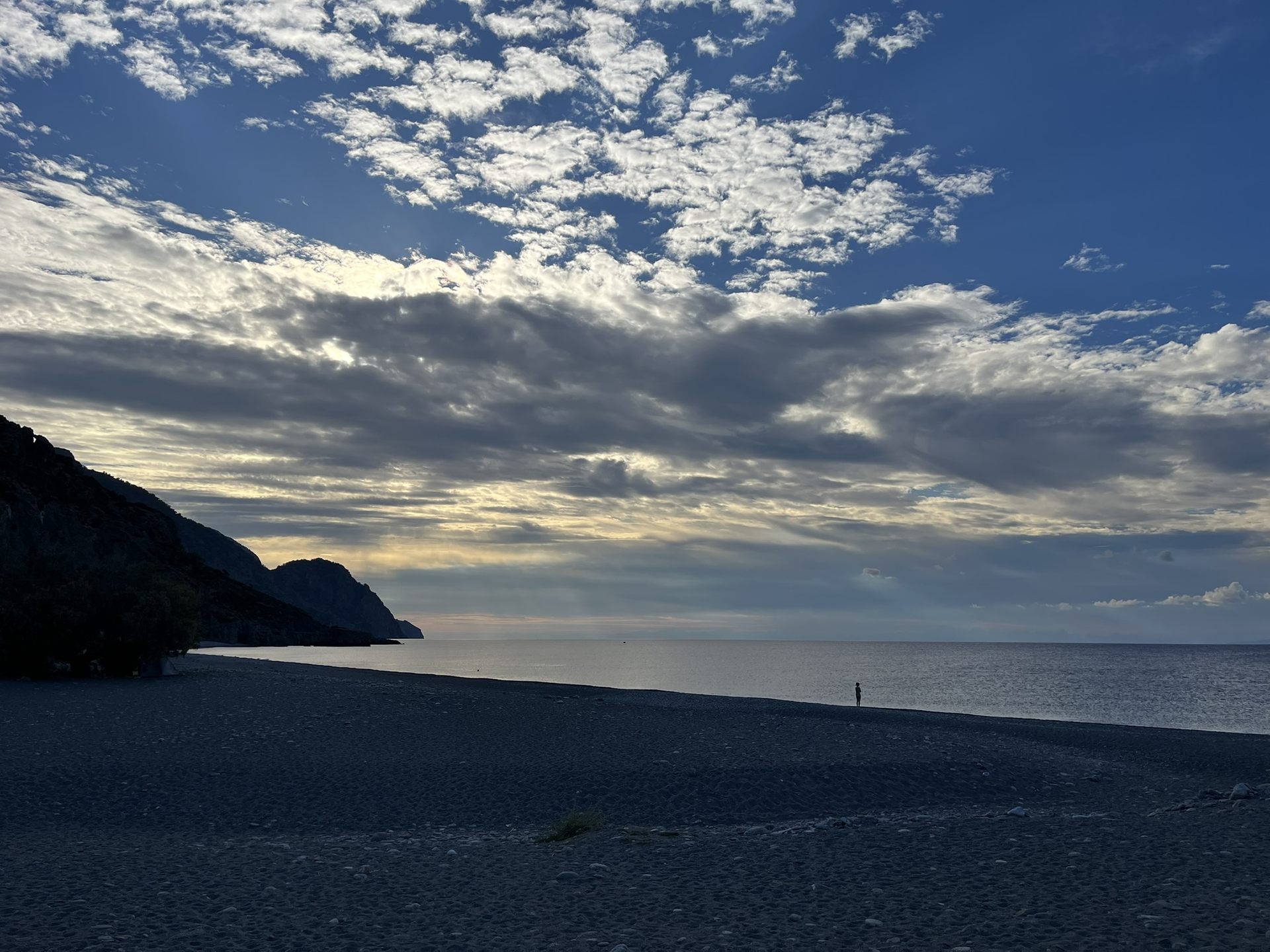 Silver clouds over the empty beach