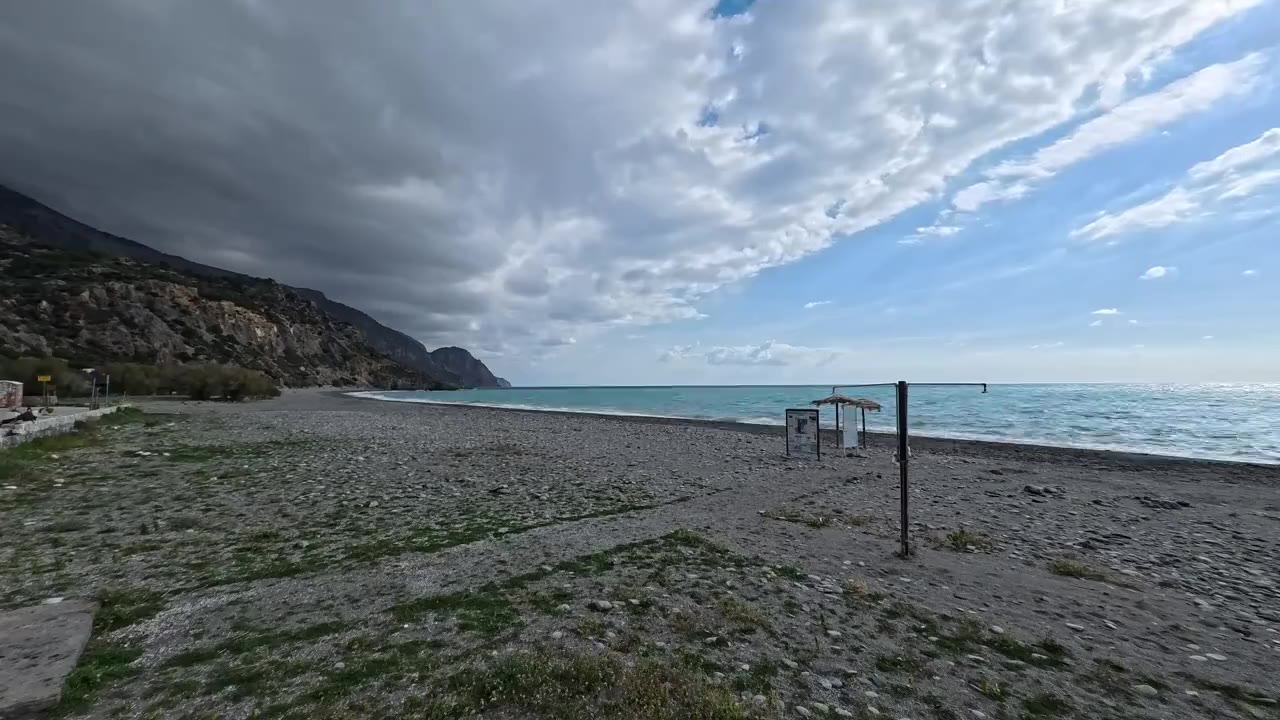 Clouds racing over the empty beach in January