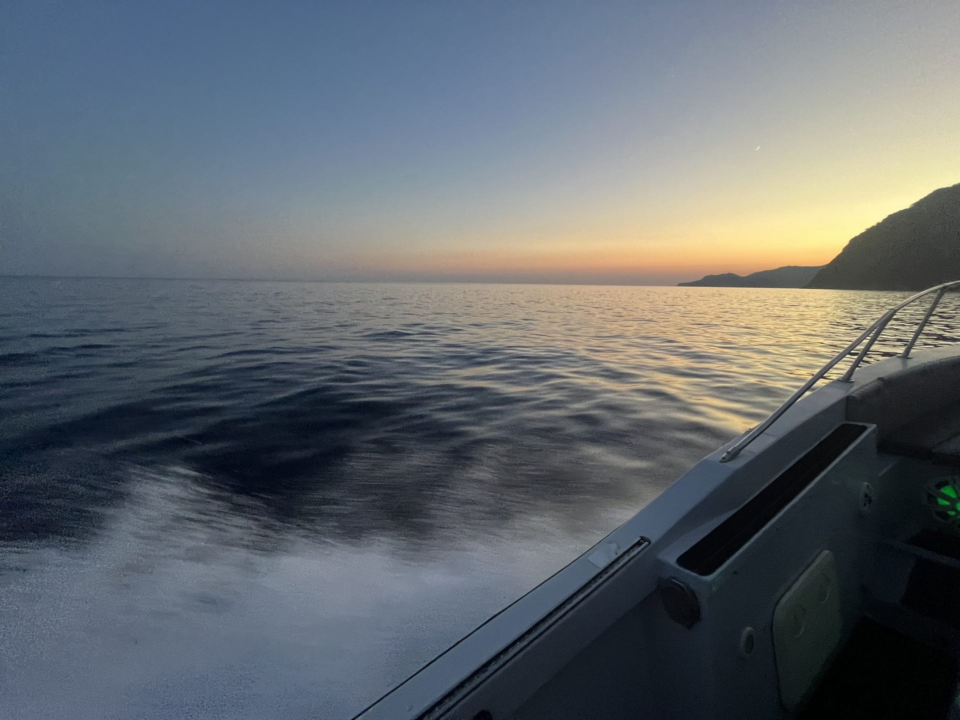 The wake of a boat at dusk